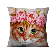 a cat with a pink hat on its head 