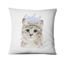 a cat sitting on top of a pillow 