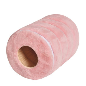 a pink doughnut is sitting on a table 
